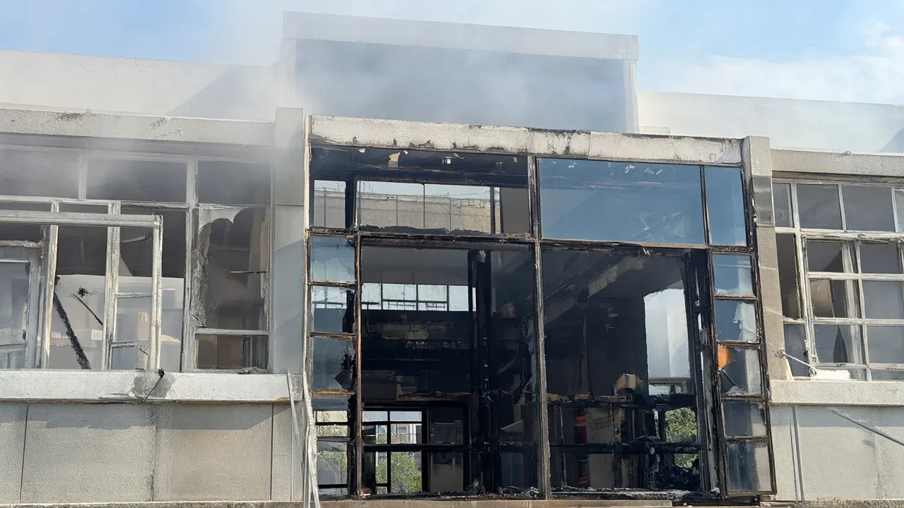 Fire damage to the glass entrance at Nelson Mandela High School in Nantes illustrates the scale of unrest that has closed hundreds of French schools.